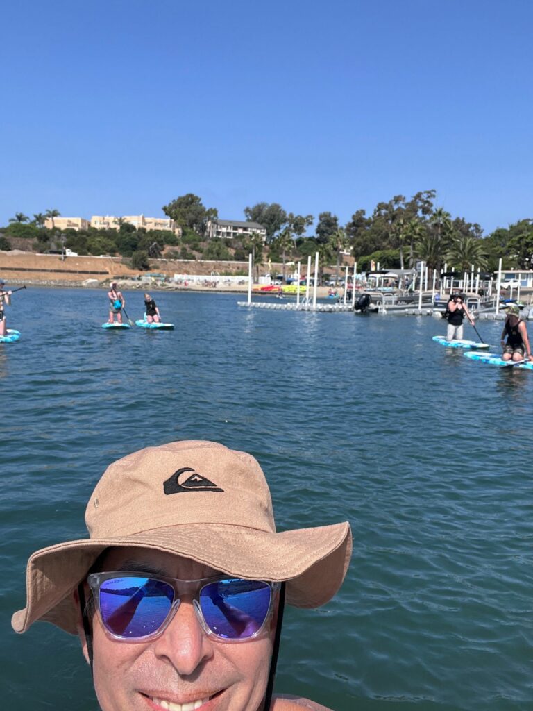 Family paddleboarding at the Carlsbad Lagoon near Ocean Hills Country Club