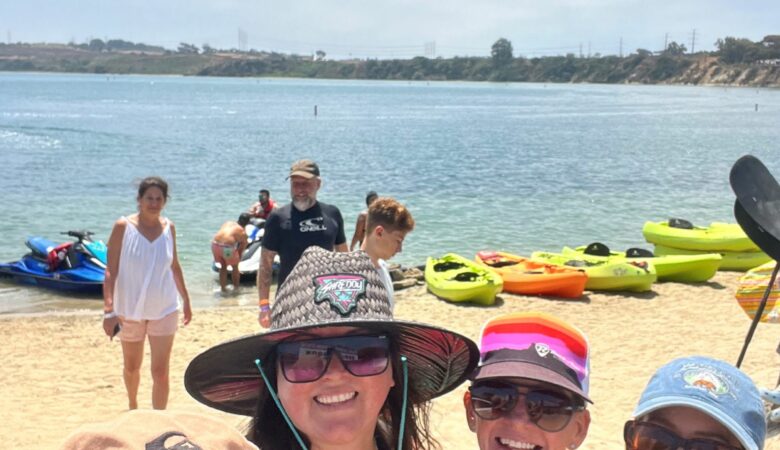 Family paddleboarding at the Carlsbad Lagoon near Ocean Hills Country Club